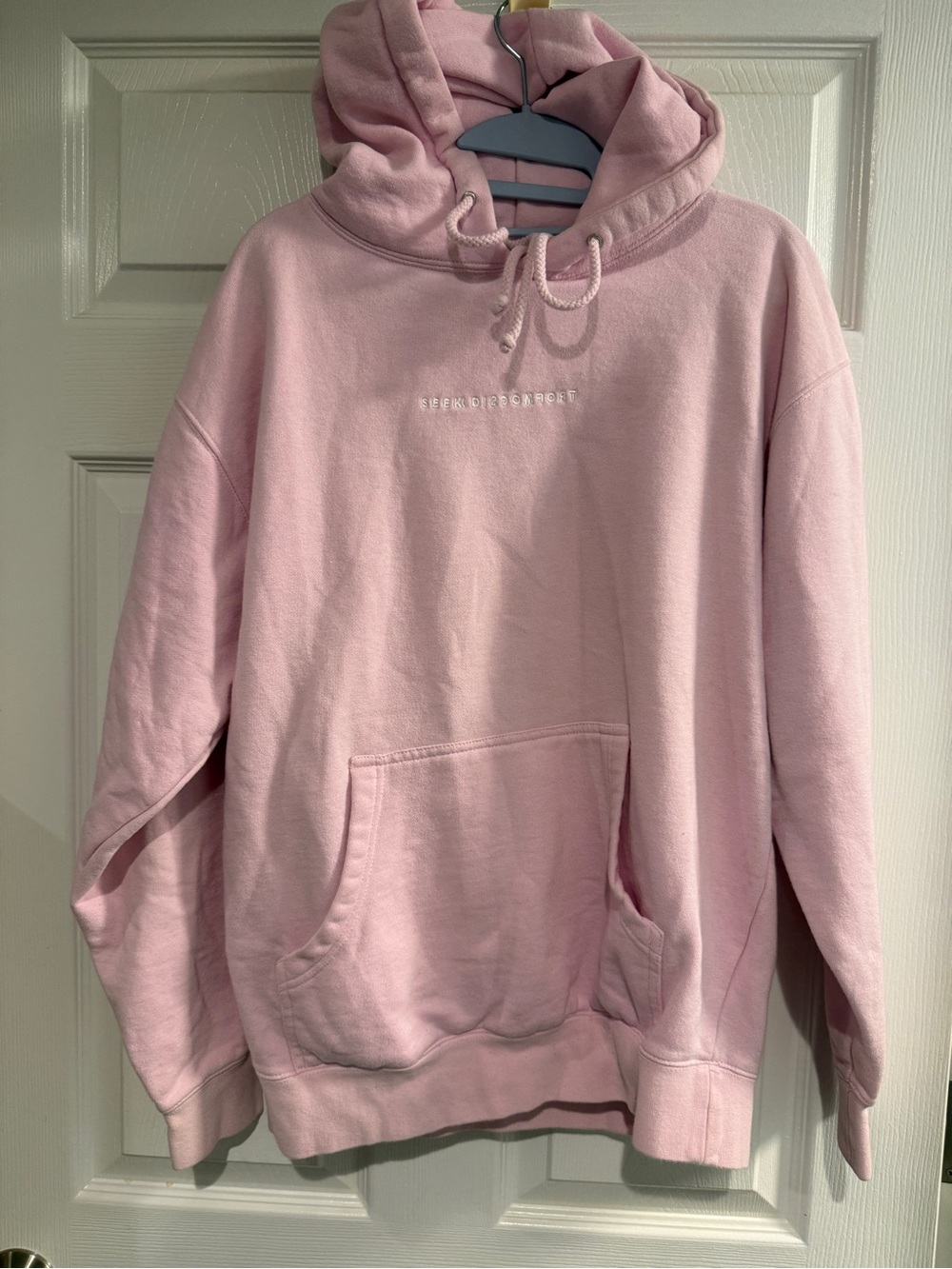Seek Discomfort Pink oversized hoodie with white embroidery